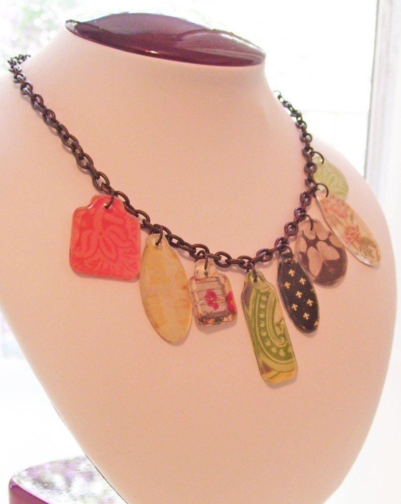 varied shapes scrapbook tags necklace, hipster, birdcage, butterfly, green, pink