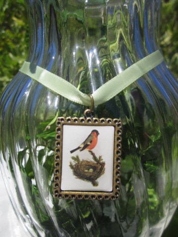 robin and nest bird charm, epoxy, antique bronze, green satin ribbon